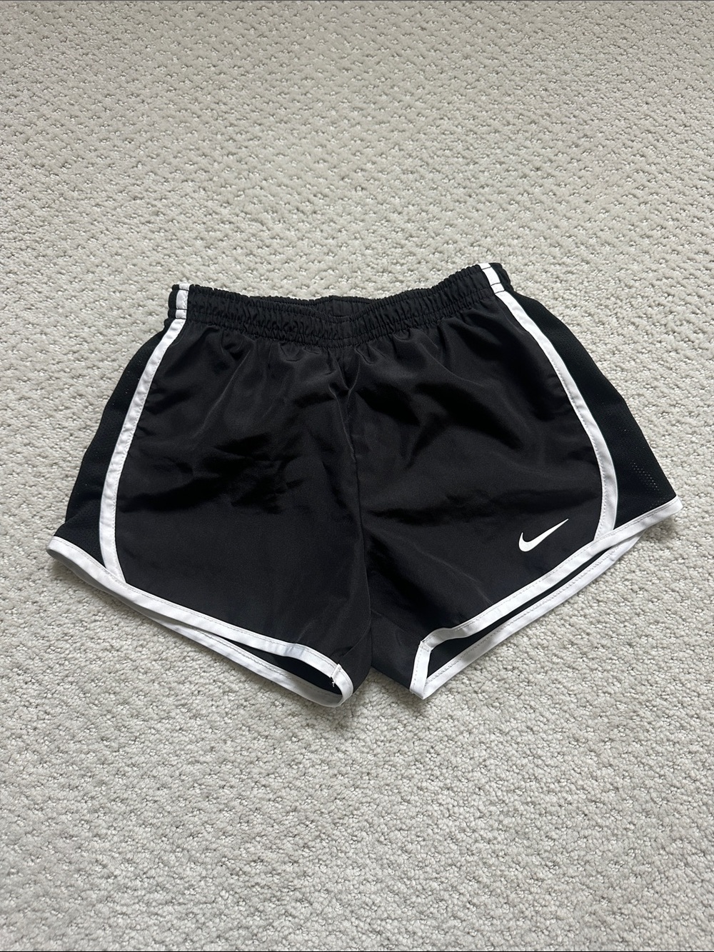 Nike kid’s Black Athletic Shorts with White Trim and Swoosh
